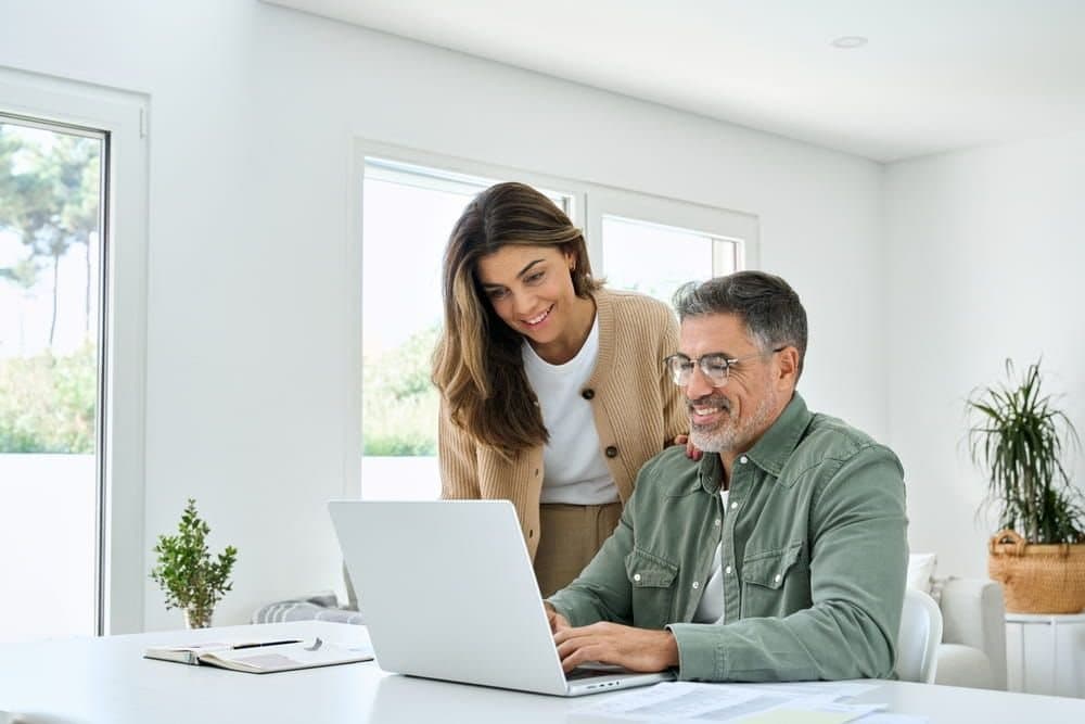 A patient talking with a clinician at a desk