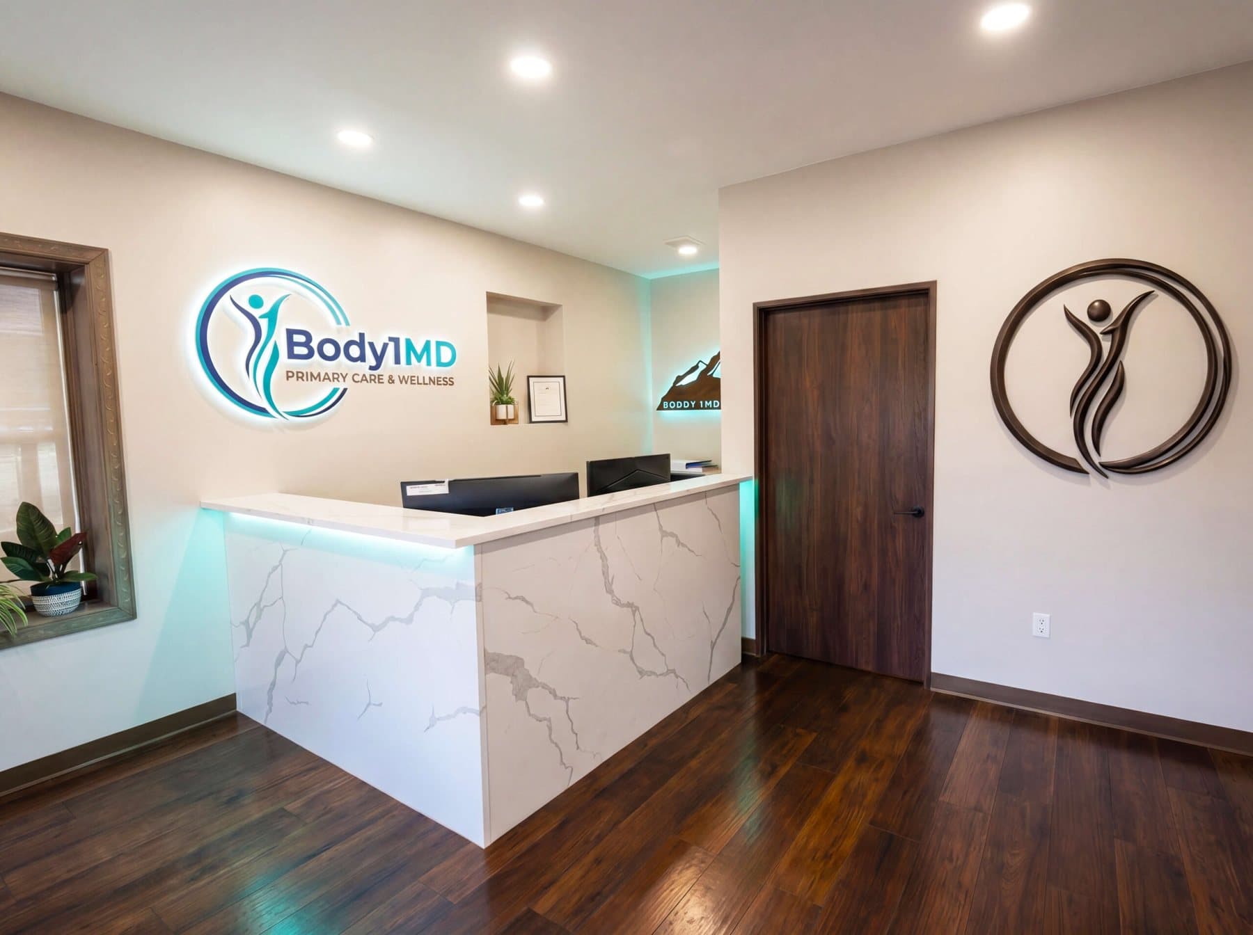 The Body1MD reception desk and logo wall